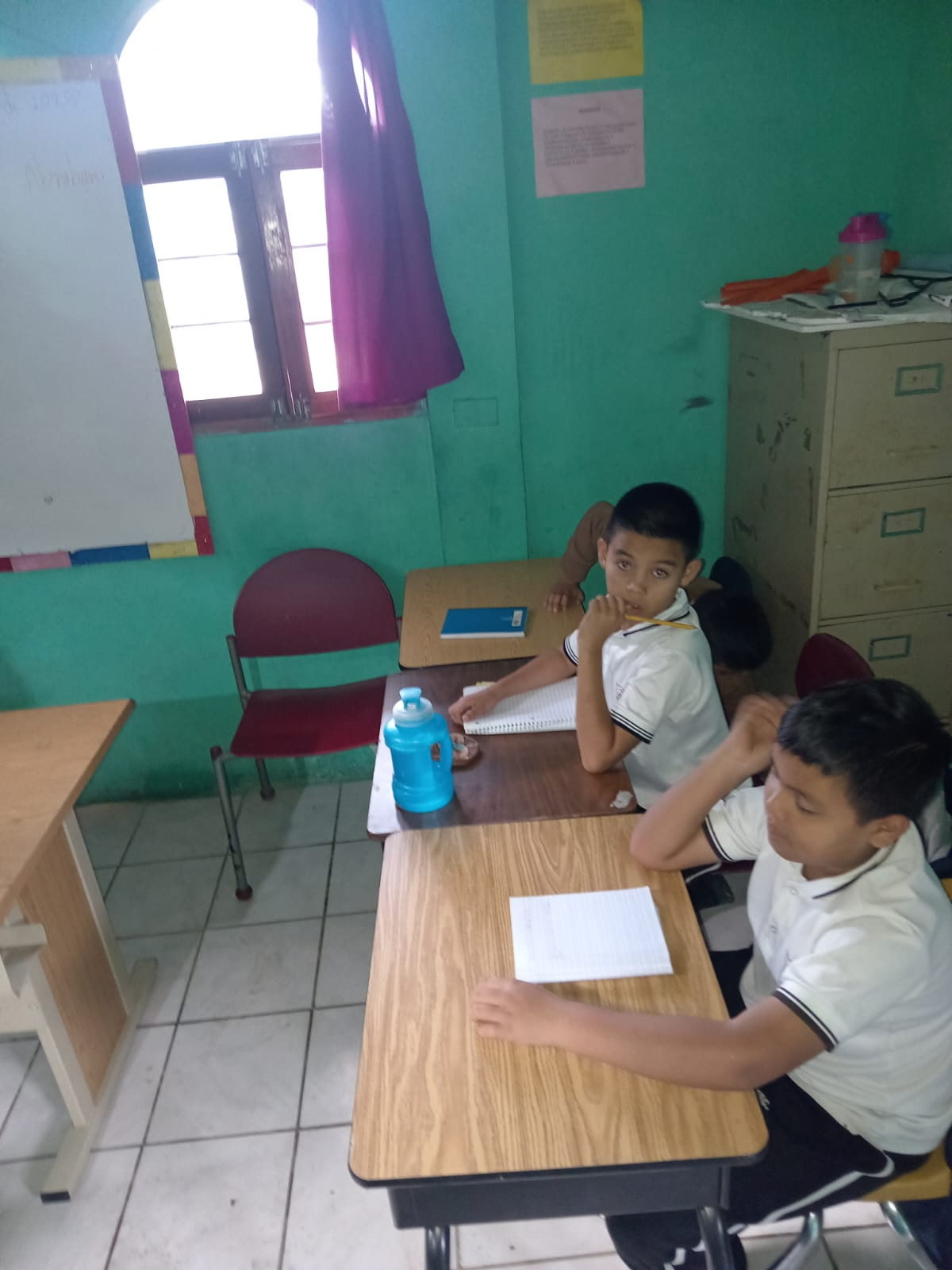 Students in La Palma, El Salvador using desks once used in Missouri classrooms.