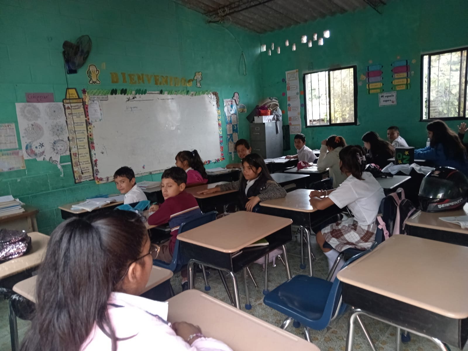 Students in La Palma, El Salvador using desks once used in Missouri classrooms.
